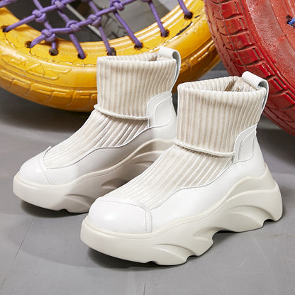 Sports sock boots with stretch platform and knitted seams