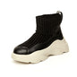 Sports sock boots with stretch platform and knitted seams
