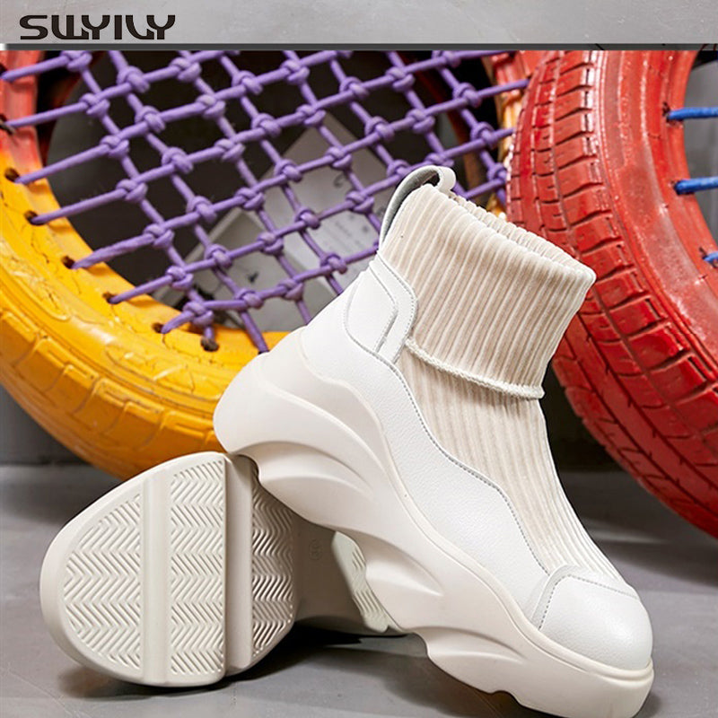 Sports sock boots with stretch platform and knitted seams