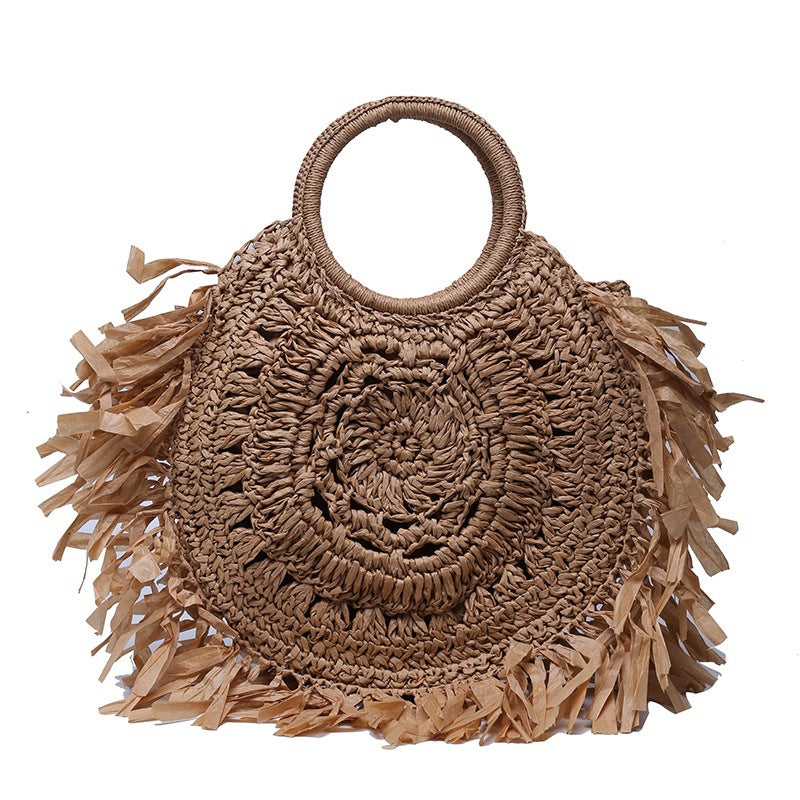 Hollow straw handbag with tassels