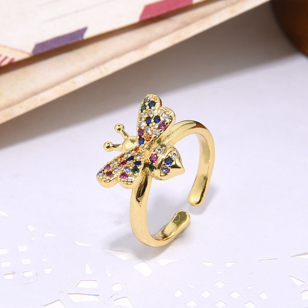 Open adjustable ladies ring in 18-carat gold with micro inlay and colored zircon