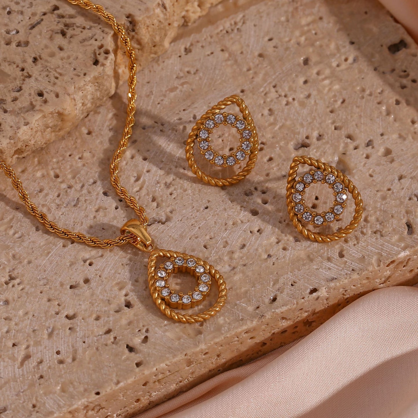 Finely inlaid ear studs with golden hollow water drop pendant necklace